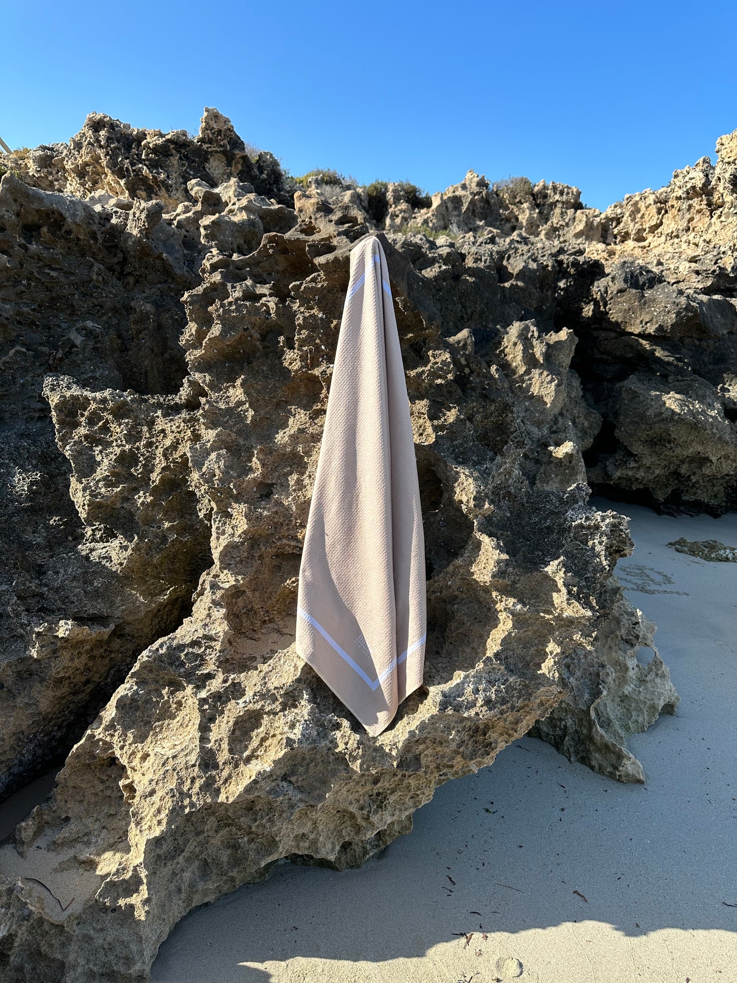 Sand-free beach towel in Sand Beige Cream colour, made from recycled materials for eco-conscious beachgoers. Our minimalist design towels are quick-dry, ultra-absorbent, lightweight and compact, and come in a convenient neoprene water resistant pouch for easy transport or storing your sunnies, keys etc. while enjoying the outdoors. Sizes available, Kids, Regular and XL Share Towel