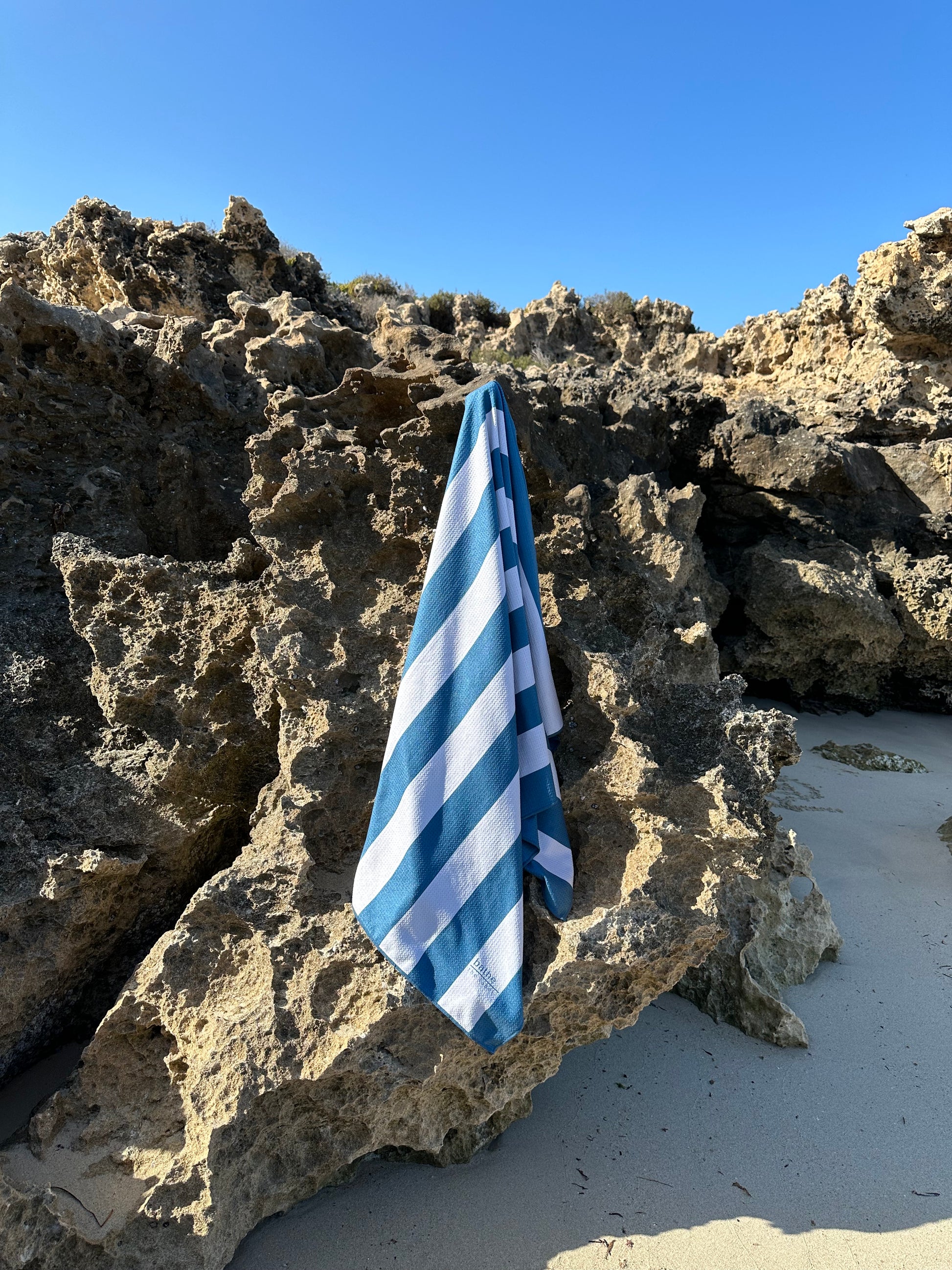 Sand-free beach towel in Deep Ocean blue green colour, made from recycled materials for eco-conscious beachgoers. Our minimalist design towels are quick-dry, ultra-absorbent, lightweight and compact, and come in a convenient neoprene water resistant pouch for easy transport or storing your sunnies, keys etc. while enjoying the outdoors. Sizes available: Kids, Regular and XL Share Towel