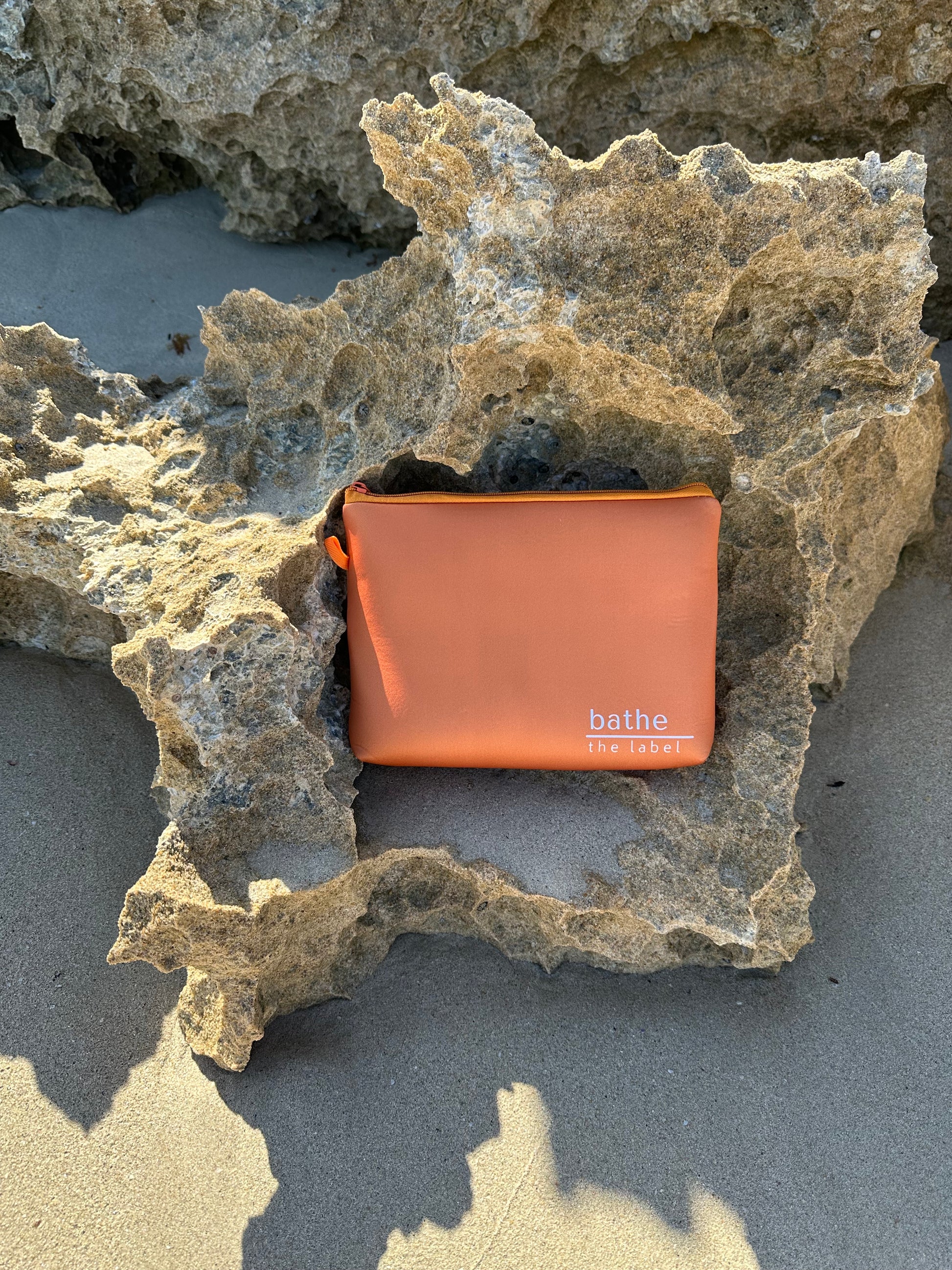 Sand-free beach towel in Apricot Crush colour, made from recycled materials for eco-conscious beachgoers. Our minimalist design towels are quick-dry, ultra-absorbent, lightweight and compact, and come in a convenient neoprene water resistant pouch for easy transport or storing your sunnies, keys etc. while enjoying the outdoors. Sizes available: Kids, Regular and XL Share Towel