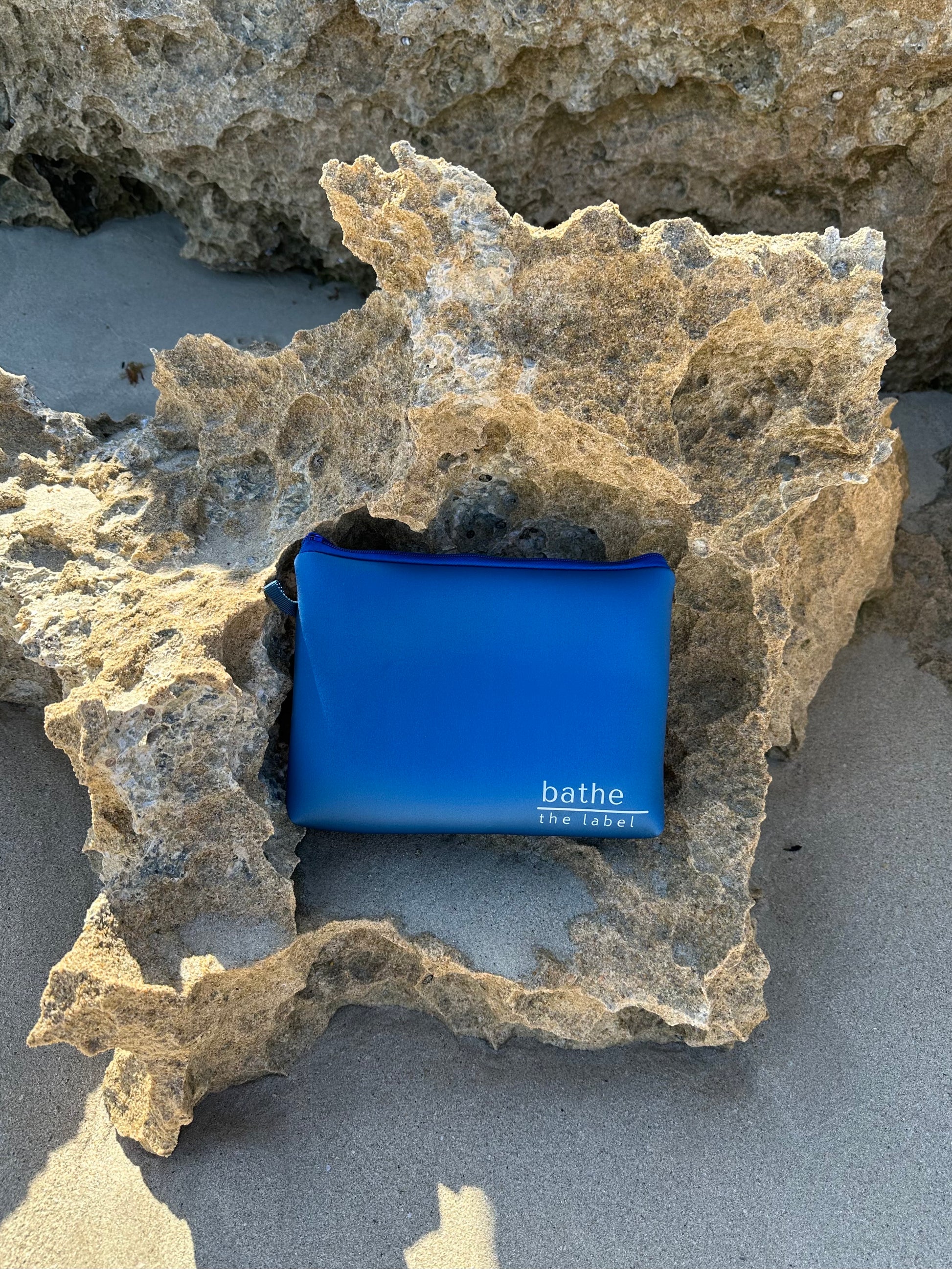 Sand-free beach towel in Deep Ocean blue green colour, made from recycled materials for eco-conscious beachgoers. Our minimalist design towels are quick-dry, ultra-absorbent, lightweight and compact, and come in a convenient neoprene water resistant pouch for easy transport or storing your sunnies, keys etc. while enjoying the outdoors. Sizes available: Kids, Regular and XL Share Towel