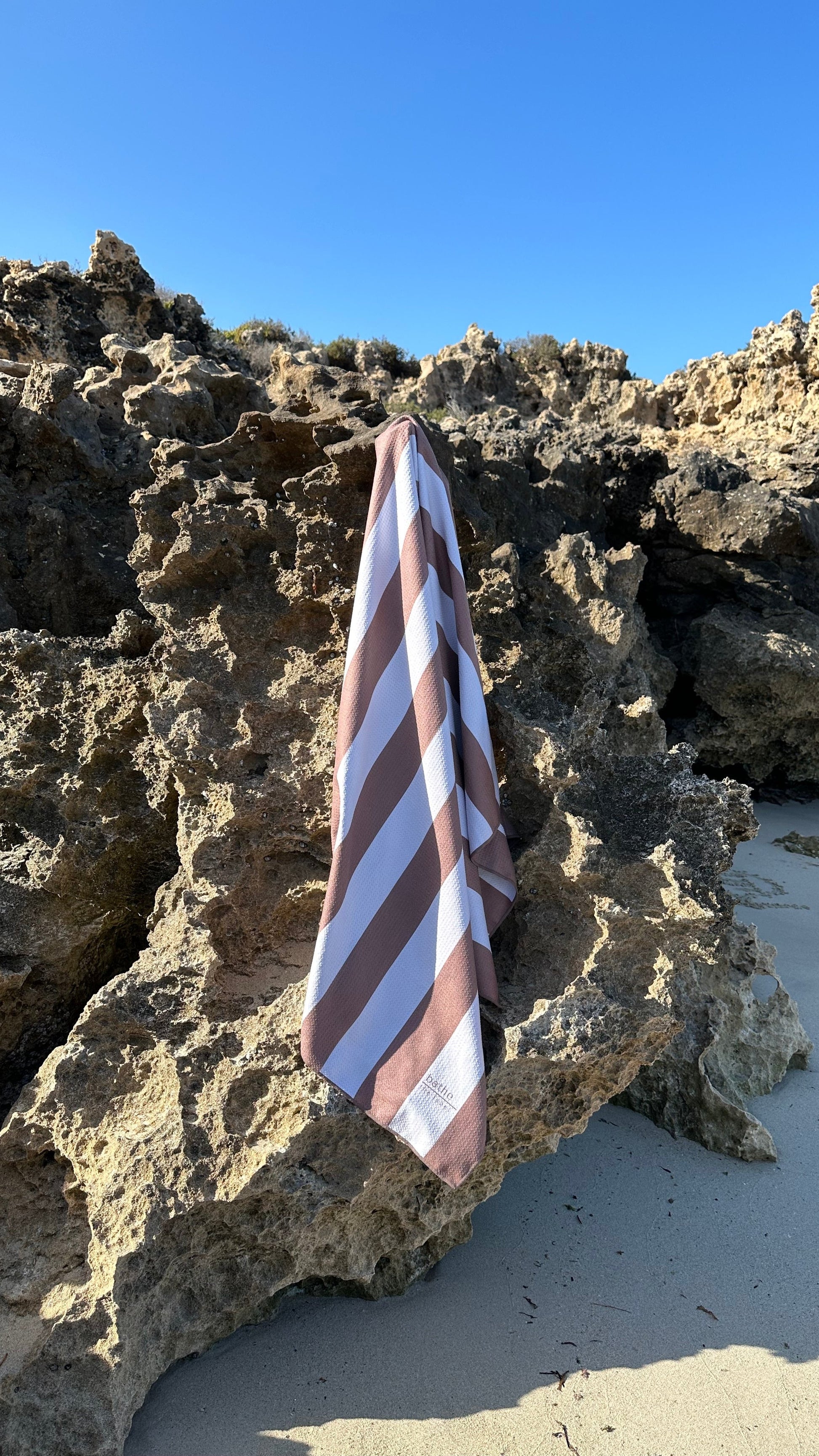 Sand-free beach towel in Coconut brown colour, made from recycled materials for eco-conscious beachgoers. Our minimalist design towels are quick-dry, ultra-absorbent, lightweight and compact, and come in a convenient neoprene water resistant pouch for easy transport or storing your sunnies, keys etc. while enjoying the outdoors. Sizes available: Kids, Regular and XL Share Towel