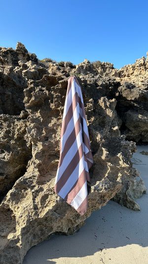 Sand-free beach towel in Coconut brown colour, made from recycled materials for eco-conscious beachgoers. Our minimalist design towels are quick-dry, ultra-absorbent, lightweight and compact, and come in a convenient neoprene water resistant pouch for easy transport or storing your sunnies, keys etc. while enjoying the outdoors. Sizes available: Kids, Regular and XL Share Towel