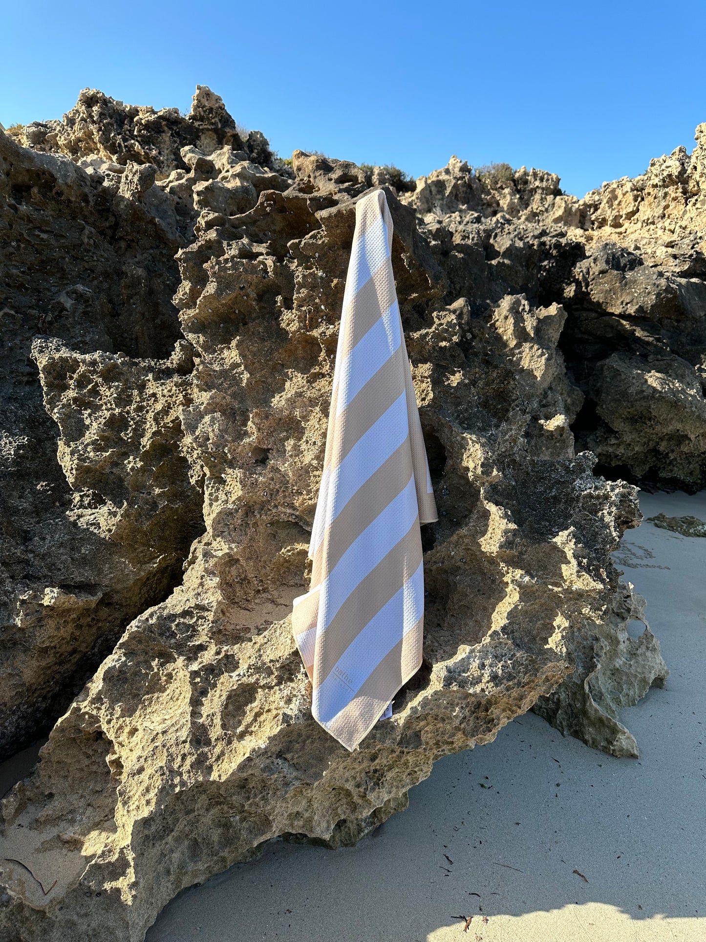 Sand-free beach towel in Sand Beige colour, made from recycled materials for eco-conscious beachgoers. Our minimalist design towels are quick-dry, ultra-absorbent, lightweight and compact, and come in a convenient neoprene water resistant pouch for easy transport or storing your sunnies, keys etc. while enjoying the outdoors. Sizes available: Kids, Regular and XL Share Towel