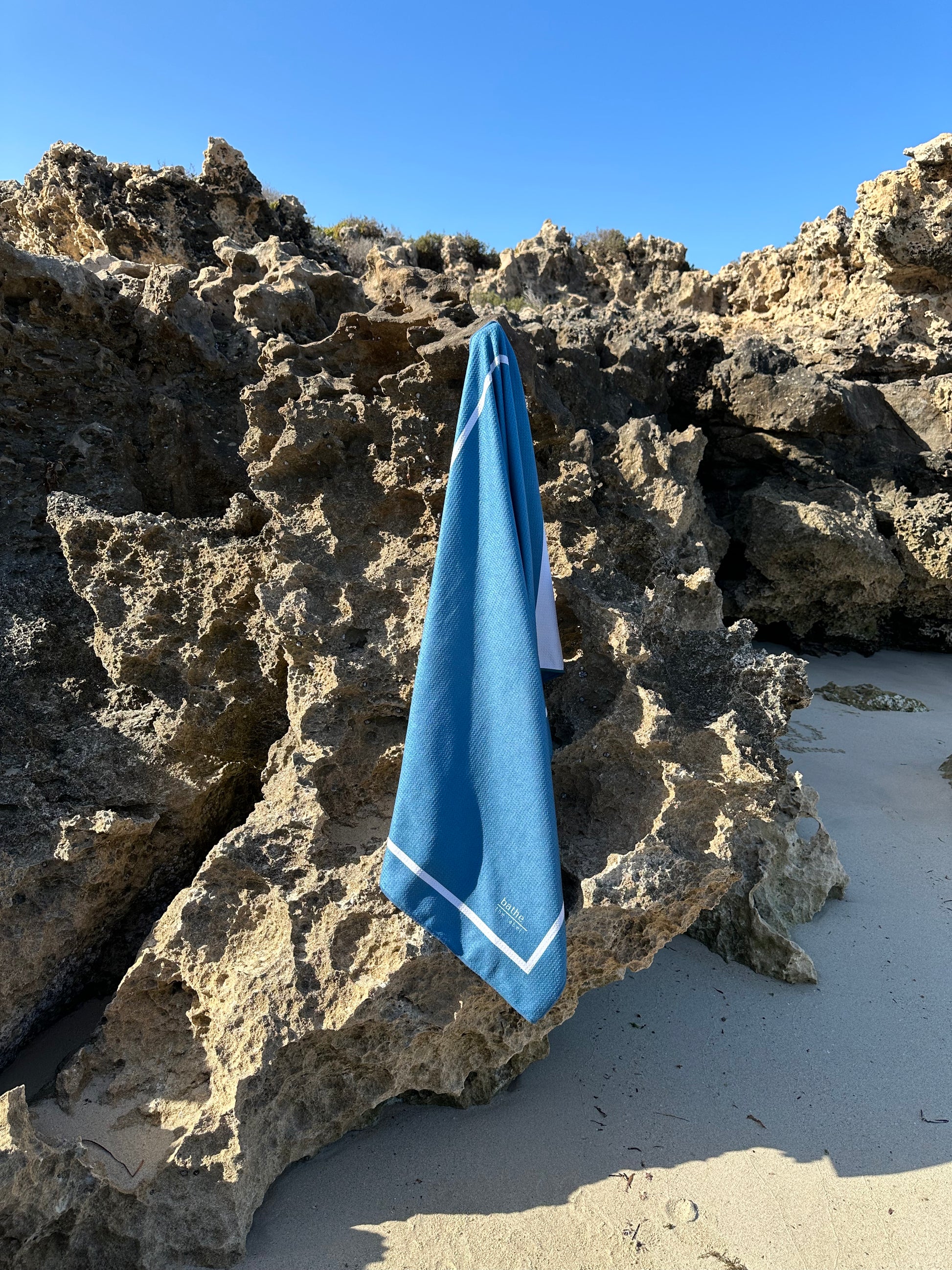 Sand-free beach towel in Deep Ocean blue green colour, made from recycled materials for eco-conscious beachgoers. Our minimalist design towels are quick-dry, ultra-absorbent, lightweight and compact, and come in a convenient neoprene water resistant pouch for easy transport or storing your sunnies, keys etc. while enjoying the outdoors. Sizes available: Kids, Regular and XL Share Towel