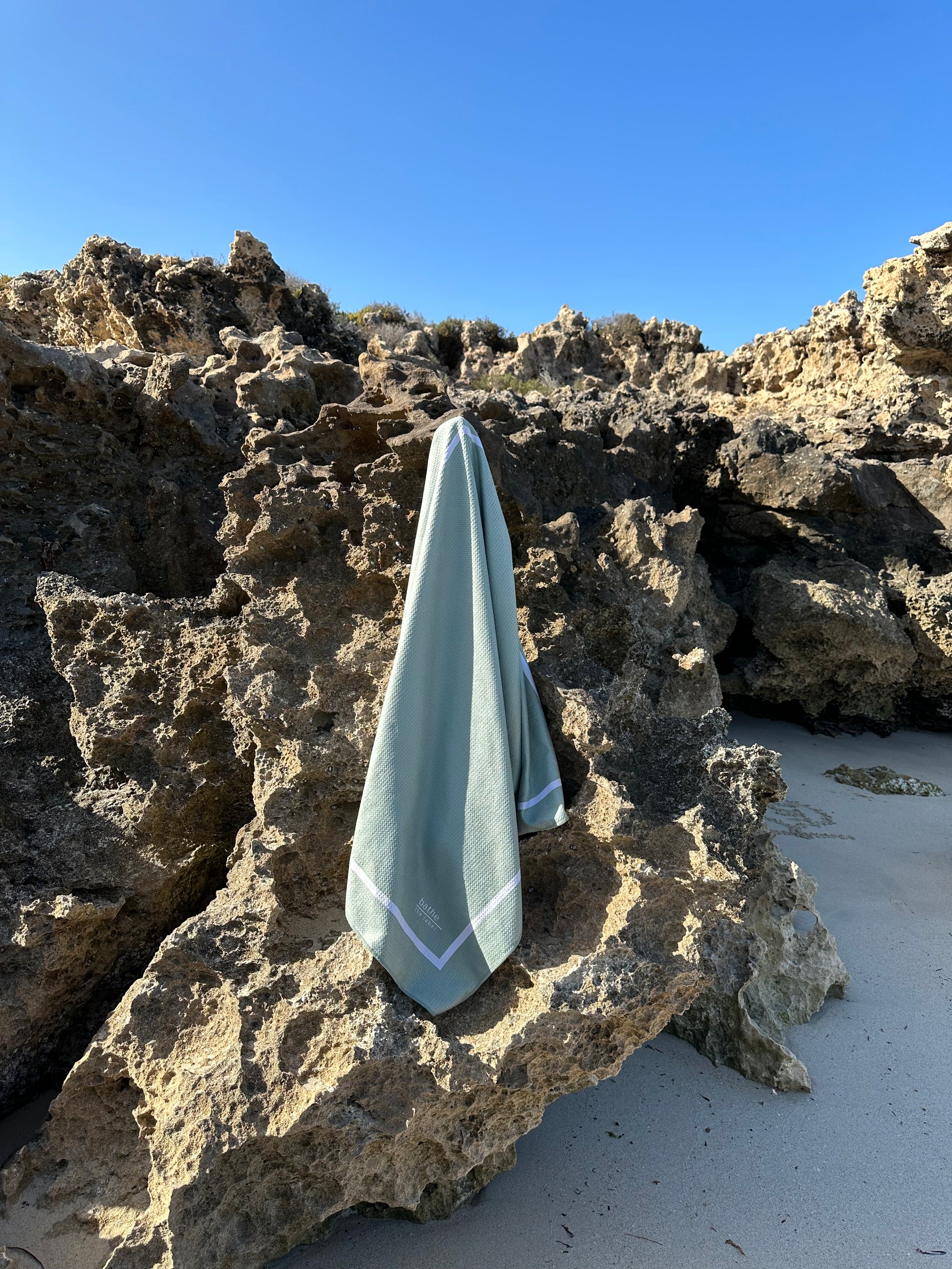 Sand-free beach towel in Sage olive green colour, made from recycled materials for eco-conscious beachgoers. Our minimalist design towels are quick-dry, ultra-absorbent, lightweight and compact, and come in a convenient neoprene water resistant pouch for easy transport or storing your sunnies, keys etc. while enjoying the outdoors. Sizes available: Kids, Regular and XL Share Towel