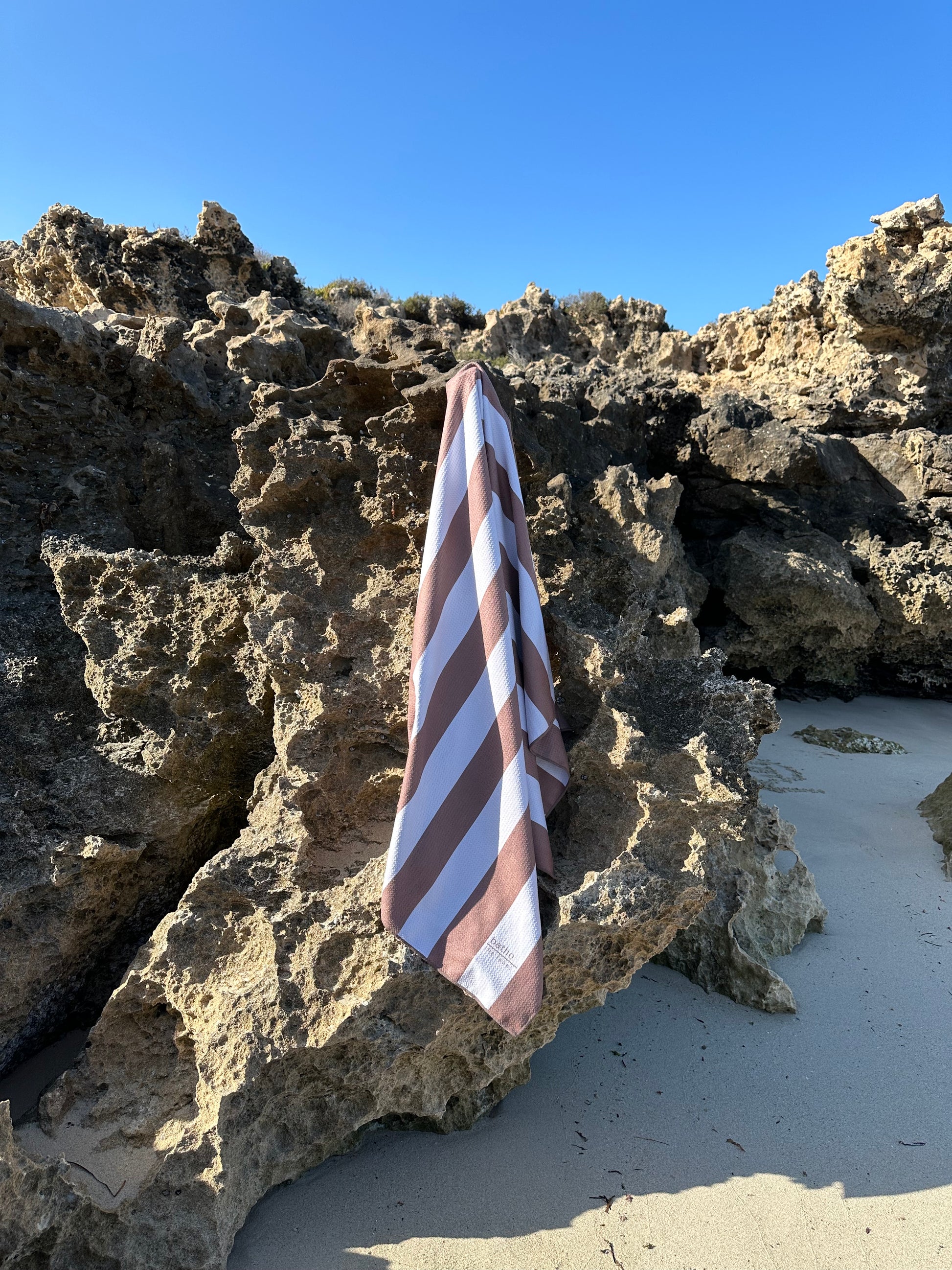 Sand-free beach towel in Coconut brown colour, made from recycled materials for eco-conscious beachgoers. Our minimalist design towels are quick-dry, ultra-absorbent, lightweight and compact, and come in a convenient neoprene water resistant pouch for easy transport or storing your sunnies, keys etc. while enjoying the outdoors. Sizes available: Kids, Regular and XL Share Towel