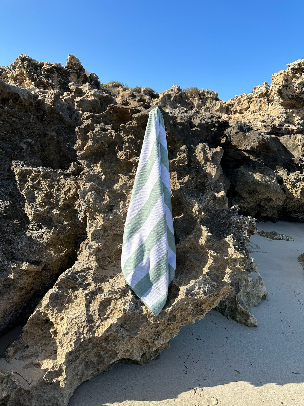 Sand-free beach towel in Sage olive green colour, made from recycled materials for eco-conscious beachgoers. Our minimalist design towels are quick-dry, ultra-absorbent, lightweight and compact, and come in a convenient neoprene water resistant pouch for easy transport or storing your sunnies, keys etc. while enjoying the outdoors. Sizes available: Kids, Regular and XL Share Towel