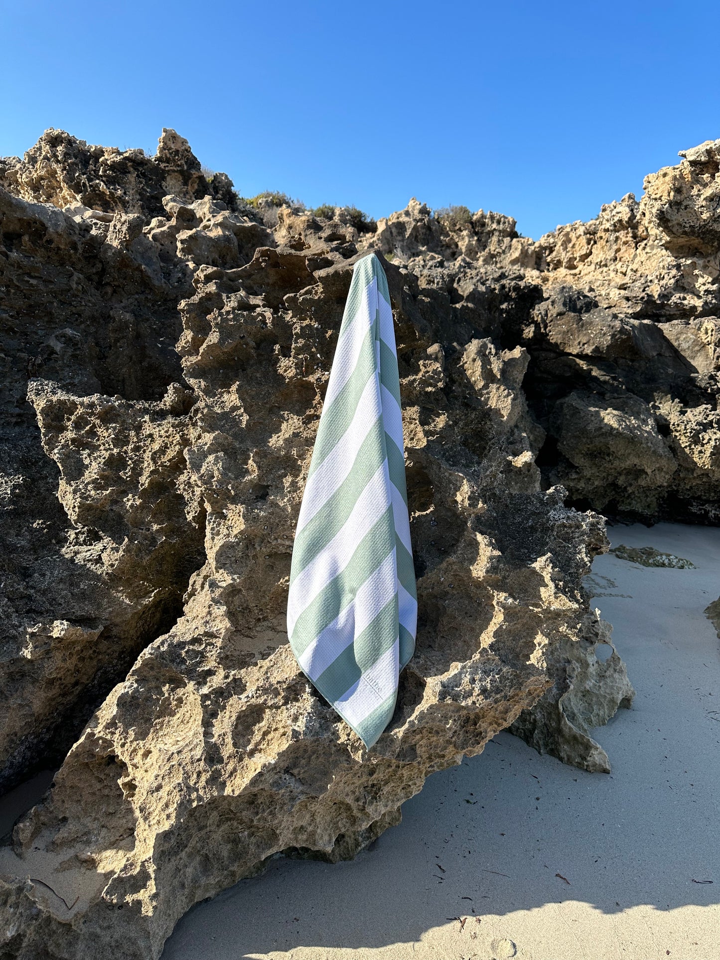 Sand-free beach towel in Sage olive green colour, made from recycled materials for eco-conscious beachgoers. Our minimalist design towels are quick-dry, ultra-absorbent, lightweight and compact, and come in a convenient neoprene water resistant pouch for easy transport or storing your sunnies, keys etc. while enjoying the outdoors. Sizes available: Kids, Regular and XL Share Towel