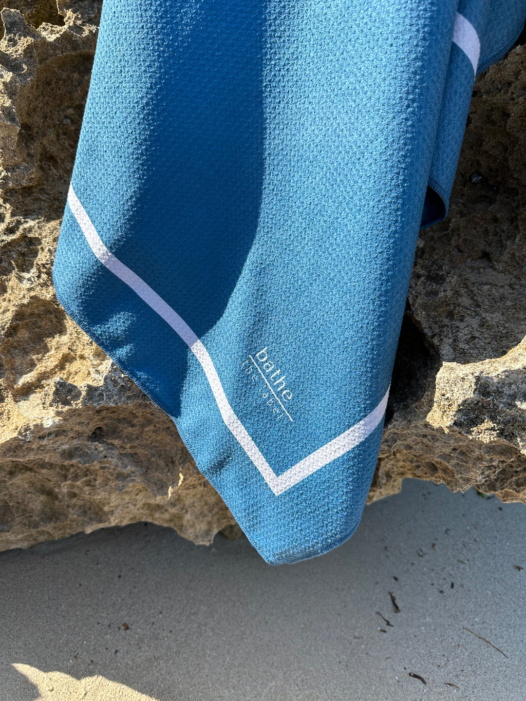 Sand-free beach towel in Deep Ocean blue green colour, made from recycled materials for eco-conscious beachgoers. Our minimalist design towels are quick-dry, ultra-absorbent, lightweight and compact, and come in a convenient neoprene water resistant pouch for easy transport or storing your sunnies, keys etc. while enjoying the outdoors. Sizes available: Kids, Regular and XL Share Towel