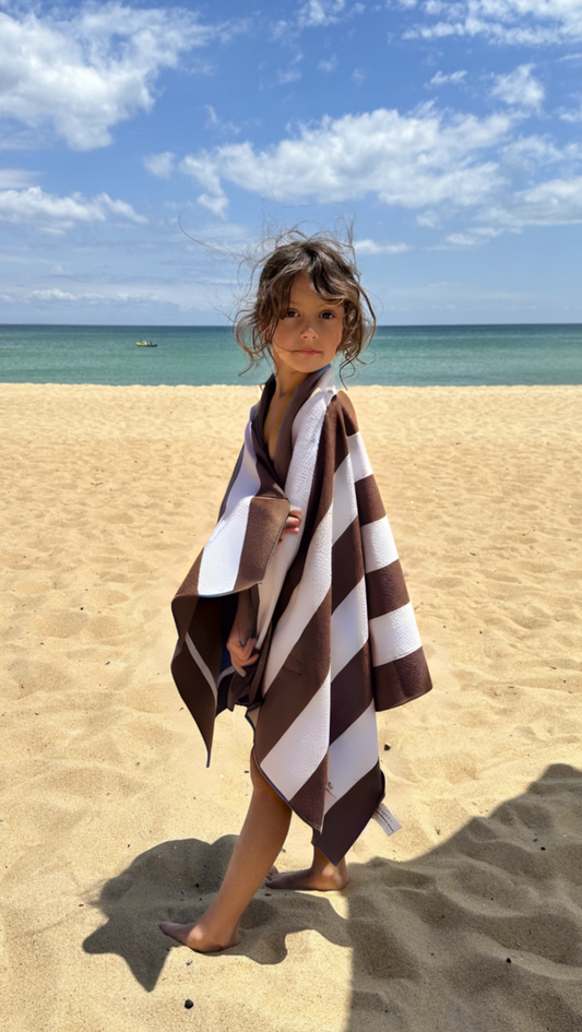 Kids Sand-free beach towel in Coconut brown colour, made from recycled materials for eco-conscious beachgoers. Our minimalist design towels are quick-dry, ultra-absorbent, lightweight and compact, and come in a convenient neoprene water resistant pouch for easy transport or storing your sunnies, keys etc. while enjoying the outdoors. Sizes available: Kids, Regular and XL Share Towel