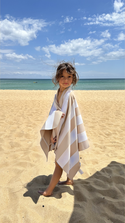 Kids Sand-free beach towel in Sand Beige colour, made from recycled materials for eco-conscious beachgoers. Our minimalist design towels are quick-dry, ultra-absorbent, lightweight and compact, and come in a convenient neoprene water resistant pouch for easy transport or storing your sunnies, keys etc. while enjoying the outdoors. Sizes available: Kids, Regular and XL Share Towel